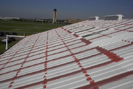 airplane-hanger-roof-seams-fasteners-sealed-fabric-reinforced-waterproof-coatings